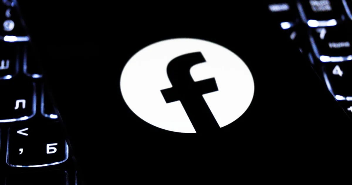 Facebook logo on a dark keyboard