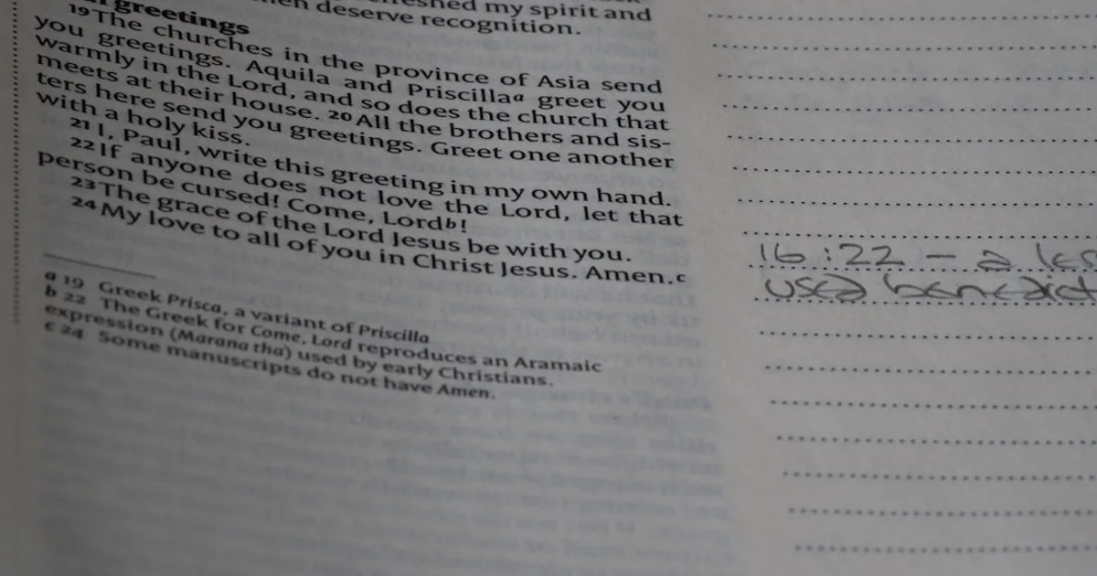 A close up of a book with writing on it